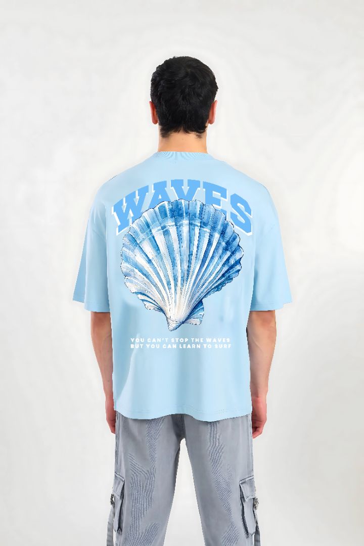 WAVES sky blue oversized T-shirt by Megakart featuring varsity-style text, shell graphic, and surf quote on premium cotton